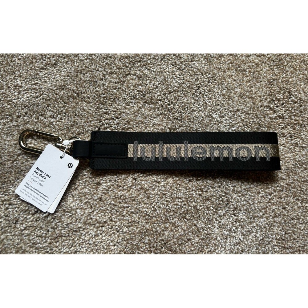 Lululemon Black and Gold Never Lost Keychain NWT